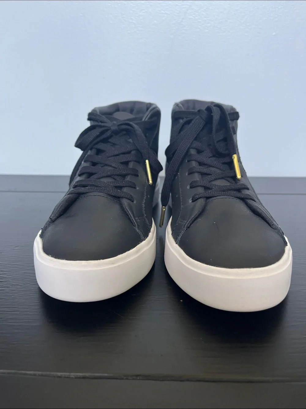Adidas W/7.5 Black High-Top Sneakers/ white sole and gold logo.